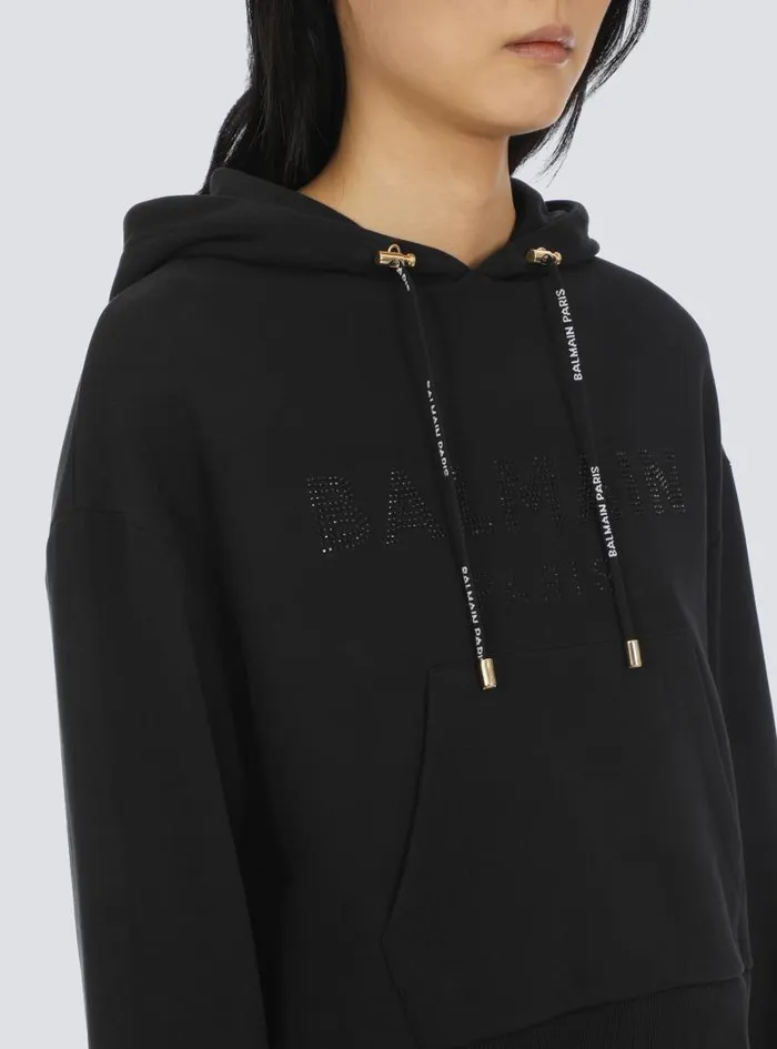 Balmain Sweatshirts Women Cropped Ecodesigned Cotton Sweatshirt With Rhinestone Logo Black Balmain Sweatshirts Women Cropped Ecodesigned Cotton Sweatshirt With Rhinestone Logo Black