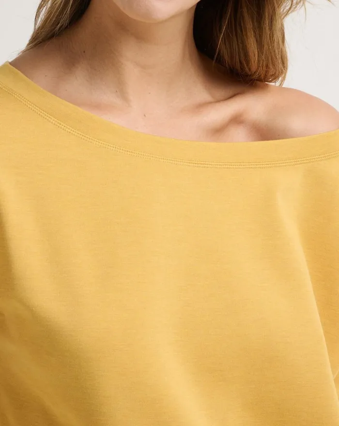 Women All Tops TravisMathew PORTUGAL OFF THE SHOULDER PONTE TOP Heather Bright Gold